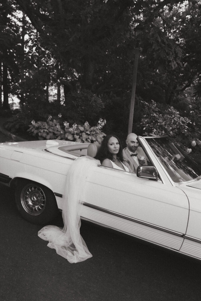 Vintage BMW with bride and groom after the seattle wedding.