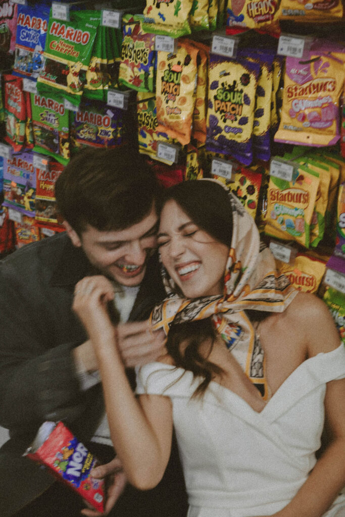 couple getting vintage photos at chevron gas station